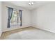 Bedroom with a large window overlooking the community; ceiling fan included at 7903 Seminole Blvd # 2204, Seminole, FL 33772