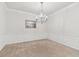 Dining room with neutral carpet, picture frame molding, and chandelier at 7903 Seminole Blvd # 2204, Seminole, FL 33772