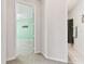 Hallway view featuring neutral carpet leading to the bedroom and bathroom at 7903 Seminole Blvd # 2204, Seminole, FL 33772