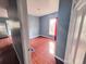 Another bedroom with wood-look floors and a large window at 804 Whitehurst Rd, Plant City, FL 33563