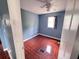 Comfortable bedroom with wood-look flooring and a ceiling fan at 804 Whitehurst Rd, Plant City, FL 33563