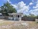 Charming single-story home featuring a welcoming front porch and fenced yard at 804 Whitehurst Rd, Plant City, FL 33563