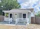 Inviting front porch with white railings and steps, perfect for relaxing outdoors at 804 Whitehurst Rd, Plant City, FL 33563