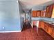 Traditional kitchen featuring wood cabinets, granite countertops, and tile flooring at 804 Whitehurst Rd, Plant City, FL 33563