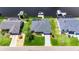 Aerial view of a well-maintained home, showcasing the landscaped yard and convenient location near the water at 829 Golf Island Dr, Apollo Beach, FL 33572