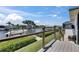 Waterfront back deck features a well-maintained yard, providing tranquil views of the canal at 829 Golf Island Dr, Apollo Beach, FL 33572