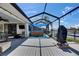 Waterfront back deck featuring a covered hot tub and outdoor dining area with views of the canal at 829 Golf Island Dr, Apollo Beach, FL 33572