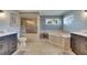 Bathroom with updated bath tub, glass shower and tiled accent wall at 829 Golf Island Dr, Apollo Beach, FL 33572