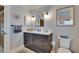 Stylish bathroom showcasing a modern vanity with dark cabinets, white countertop, and updated fixtures at 829 Golf Island Dr, Apollo Beach, FL 33572