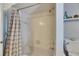 Clean bathroom featuring a tiled shower, tub and updated fixtures at 829 Golf Island Dr, Apollo Beach, FL 33572