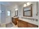 Bright bathroom with dual sinks, granite countertops, and well-lit mirrors at 829 Golf Island Dr, Apollo Beach, FL 33572