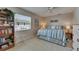 Calm and inviting bedroom with large window, neutral walls, and decorative book shelves providing ample storage at 829 Golf Island Dr, Apollo Beach, FL 33572