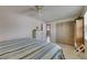 Comfortable bedroom featuring neutral walls, tile floors and a ceiling fan for added comfort at 829 Golf Island Dr, Apollo Beach, FL 33572