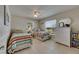 Inviting bedroom featuring twin beds, natural light and tile flooring throughout at 829 Golf Island Dr, Apollo Beach, FL 33572