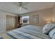 Tranquil bedroom featuring a comfortable bed, ceiling fan, and closet space, perfect for rest and relaxation at 829 Golf Island Dr, Apollo Beach, FL 33572