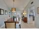Bright dining area with open layout, french doors to patio, and tile floors at 829 Golf Island Dr, Apollo Beach, FL 33572