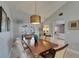 Charming dining room with French doors to the patio and elegant lighting at 829 Golf Island Dr, Apollo Beach, FL 33572