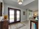 Bright and spacious foyer featuring elegant double doors and neutral decor at 829 Golf Island Dr, Apollo Beach, FL 33572