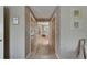 Hallway providing access to the bathroom and closet with neutral paint and flooring at 829 Golf Island Dr, Apollo Beach, FL 33572