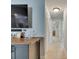 Hallway featuring wood bar, tile flooring, and built-in bar, leading to other areas of the house at 829 Golf Island Dr, Apollo Beach, FL 33572