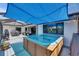 Deck features a luxurious hot tub, outdoor seating and dining areas, perfect for entertaining at 829 Golf Island Dr, Apollo Beach, FL 33572