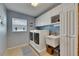 Bright laundry room features a washer, dryer, sink, cabinets and a window providing natural light at 829 Golf Island Dr, Apollo Beach, FL 33572