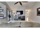 Open-concept living area with sliding doors to lanai, tile floors, and built-in bar area at 829 Golf Island Dr, Apollo Beach, FL 33572