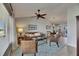 Comfortable living room with vaulted ceilings, fan, and open access to dining area at 829 Golf Island Dr, Apollo Beach, FL 33572