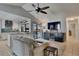 A view of the living room as it opens to a beautifully designed modern kitchen at 829 Golf Island Dr, Apollo Beach, FL 33572