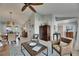 Inviting living room with high ceilings, tile floors, ceiling fan, and stylish decor at 829 Golf Island Dr, Apollo Beach, FL 33572