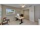 Functional office features a window overlooking the front yard, a ceiling fan and ample storage at 829 Golf Island Dr, Apollo Beach, FL 33572