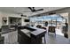 Covered outdoor area features a large bar, multiple ceiling fans, and access to the pool at 829 Golf Island Dr, Apollo Beach, FL 33572