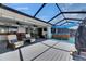 Covered outdoor space offers seating, bar, dining, hot tub, and waterfront views for relaxing at 829 Golf Island Dr, Apollo Beach, FL 33572