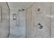 Close up of updated shower with marble-look surround, detachable shower head and built in storage at 829 Golf Island Dr, Apollo Beach, FL 33572