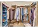 Walk-in closet with plenty of storage space including shelves and rods for hanging clothes at 829 Golf Island Dr, Apollo Beach, FL 33572