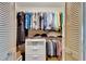Walk-in closet with plenty of storage space including shelves and rods for hanging clothes at 829 Golf Island Dr, Apollo Beach, FL 33572