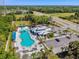 The aerial view shows the community pool, clubhouse, and surrounding green spaces at 8437 White Poplar Dr, Riverview, FL 33578