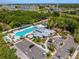 An aerial view showcases the community pool, clubhouse, parking and recreational facilities at 8437 White Poplar Dr, Riverview, FL 33578