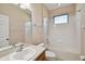 A full bathroom with a shower and tub combination and a large mirror at 8437 White Poplar Dr, Riverview, FL 33578