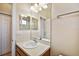 A well lit bathroom features a large mirror, vanity, and a shower at 8437 White Poplar Dr, Riverview, FL 33578