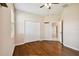This bedroom has hardwood floors, a ceiling fan and large double door closet at 8437 White Poplar Dr, Riverview, FL 33578