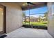 This screened lanai features a large window overlooking the backyard at 8437 White Poplar Dr, Riverview, FL 33578