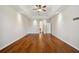 Large living area with tray ceilings, hardwood floors, recessed lighting and neutral walls at 8437 White Poplar Dr, Riverview, FL 33578