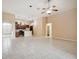 Spacious living room with tile floors adjacent to open kitchen, great for entertaining at 8437 White Poplar Dr, Riverview, FL 33578