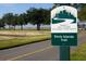 Sign for Davis Islands Trail, part of Tampa's Ross J. Ferlita Greenways & Trails System near a paved path at 85 Davis Blvd # D, Tampa, FL 33606