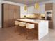 Contemporary kitchen features an island with seating, modern appliances, and custom wood cabinetry at 85 Davis Blvd # D, Tampa, FL 33606