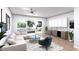 Cozy living room featuring a comfortable sectional sofa, stylish decor, and sliding glass doors to an outdoor patio at 85 Davis Blvd # D, Tampa, FL 33606