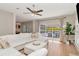 Spacious living room with a large window, stylish furnishings, and plenty of natural light at 9715 Pleasant Run Way, Tampa, FL 33647