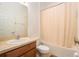 A cozy bathroom with a shower-tub combo, toilet, and sink for everyday convenience at 9954 N Jasmine Brook E Cir, Land O Lakes, FL 34638