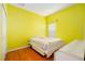 Bedroom with bed, natural light, and hardwood floors for a serene and relaxing atmosphere at 9954 N Jasmine Brook E Cir, Land O Lakes, FL 34638